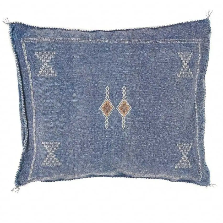 A rectangular indigo blue cactus silk pillow with geometric patterns and a central decorative motif.