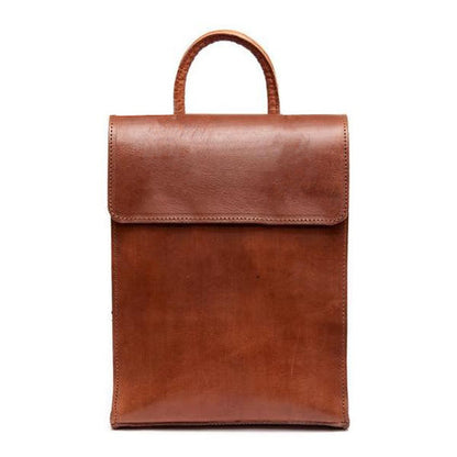 Brown leather bag with a flap on a white background