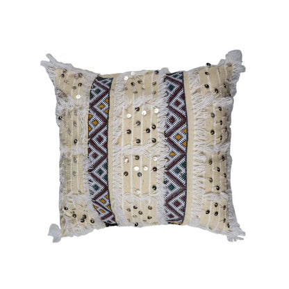 Beige Moroccan Handira pillow cover with multicolor Berber embroidery, white fringe, and silver sequins, handcrafted from wool and cotton.
