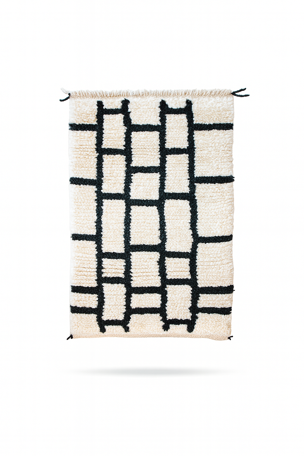 Handwoven Beni Ourain mini rug with ivory wool base and bold black gridline pattern.

