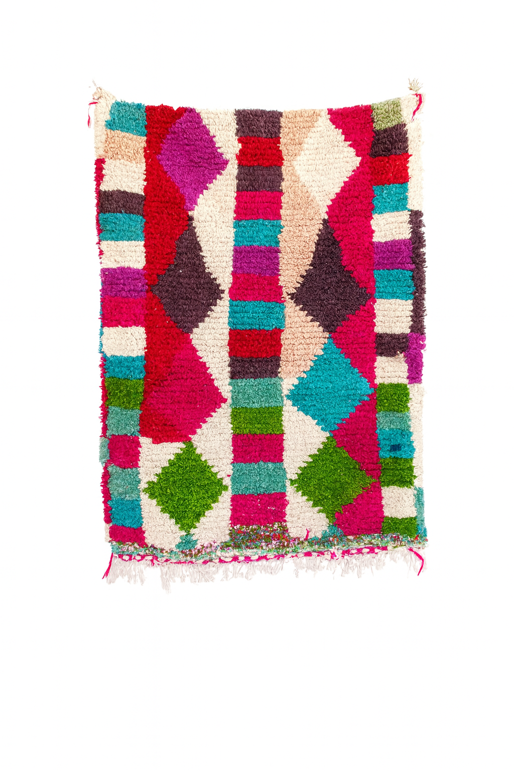 Handwoven Beni Ourain mini rug with vibrant jewel toned geometric block pattern on an ivory base.
