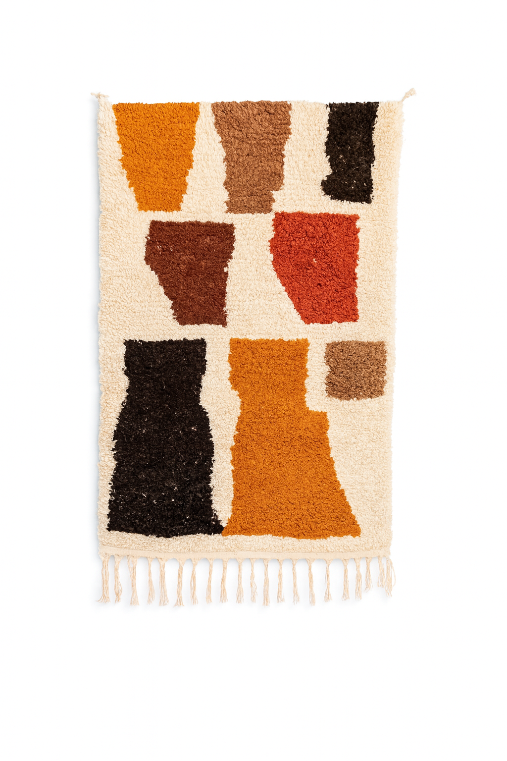 Handwoven Beni Ourain mini rug with warm earth toned geometric block shapes on an ivory wool background.
