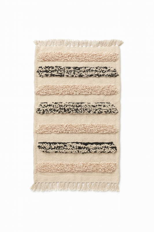 Handwoven Beni Ourain mini rug with ivory wool base and neutral textured stripe pattern.
