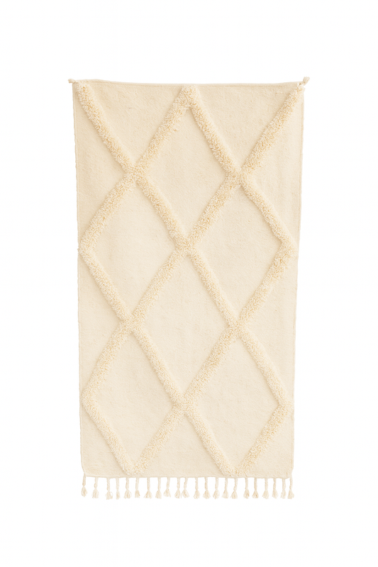 Handwoven Boujad mini rug in ivory with raised diamond textured pattern.
