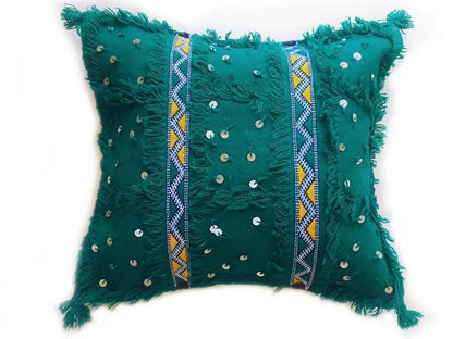 Green Moroccan Handira pillow cover with sequins, fringe, and traditional Berber embroidery, handcrafted from cotton and wool.