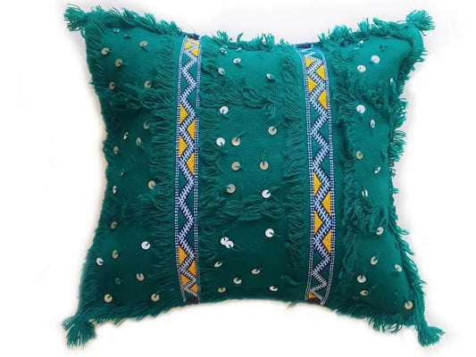Green Moroccan Handira pillow cover with sequins, fringe, and traditional Berber embroidery, handcrafted from cotton and wool.