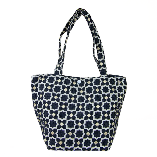 Tote bag with black and white geometric pattern on a beige background