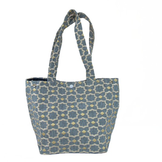 Patterned tote bag on a beige background