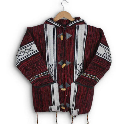 Handwoven Moroccan wool jacket in deep red with bold white Amazigh stripes natural toggle closure hooded design and relaxed unisex fit
